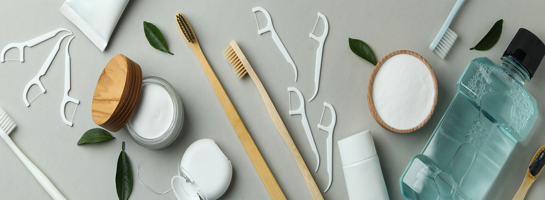 This is a composite image showing medical equipment and supplies, including a stethoscope, blood pressure cuff, tongue depressors, and other instruments, arranged in a manner that suggests they are part of a medical examination or procedure. The background is a solid color to emphasize the items.